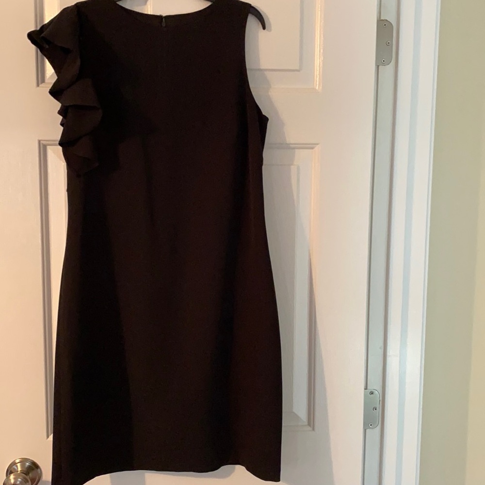 Black dress with ruffle on right side, size 6.